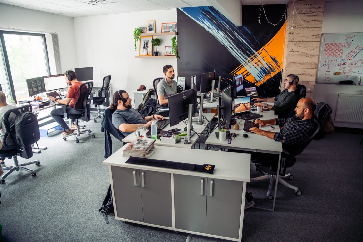 IT Engine team collaborating in a meeting room